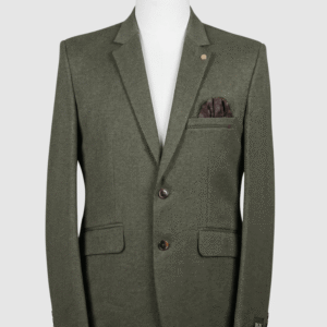 A men's tailored smart fit coat in a solid olive green fabric on a mannequin. The coat features a subtle lapel pin, dark buttons, and a dark patterned pocket square. Turkish stitching and branded fabric are present.