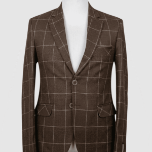 A tailored smart fit coat made of brown grid patterned Iranian fabric on a mannequin. The coat features a clean, classic design with dark buttons and a solid brown pocket square.