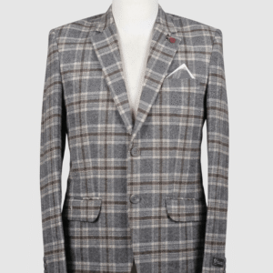 A tailored smart fit coat made of Iranian grey and brown plaid fabric on a mannequin. The coat features a dark red lapel pin, dark buttons, and a crisp white pocket square.