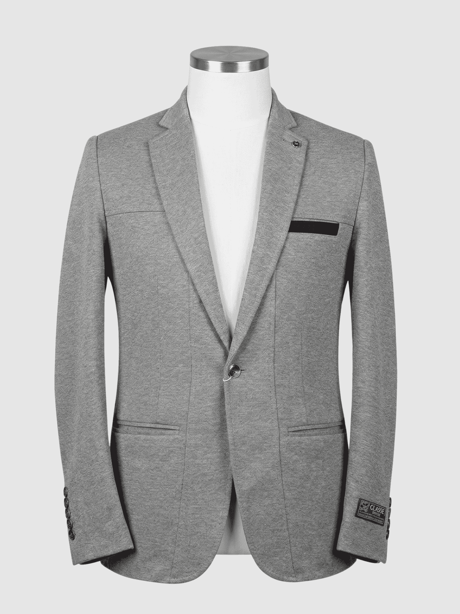Iranian Fabric Grey Contrast Smart Fit Coat - Kamal Clan A tailored smart fit coat made of light grey Iranian fabric on a mannequin. The coat features a sleek lapel pin, dark buttons, and a striking black contrast trim on the breast pocket.