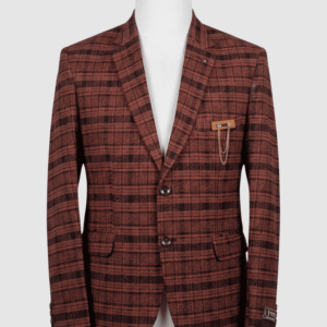 A tailored smart fit coat made of rust-brown and dark plaid Iranian fabric on a mannequin. The coat features a sleek lapel pin, dark buttons, and a unique metallic chain brooch detail on the breast pocket.